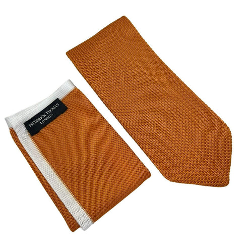 Matching orange knitted 8cm pointed end tie and pocket square
