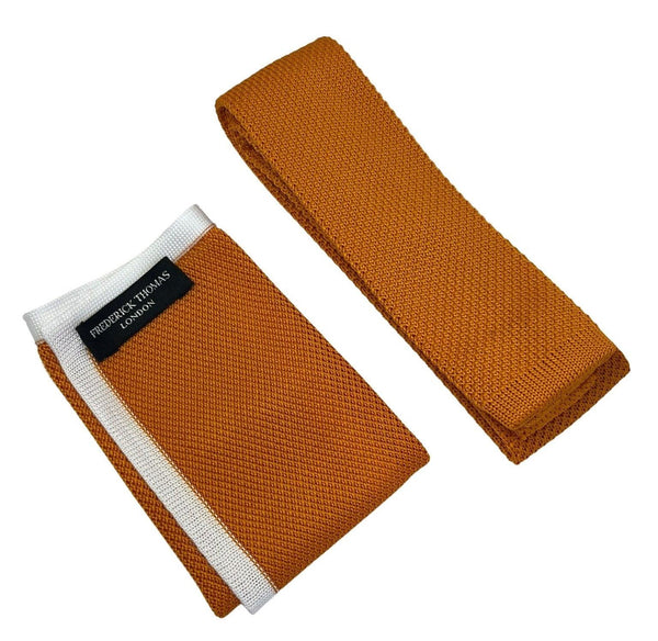 Matching orange knitted flat end tie and pocket square