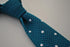teal skinny knitted tie with white polka dots