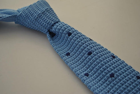 light blue skinny knitted tie with dark blue polka dots