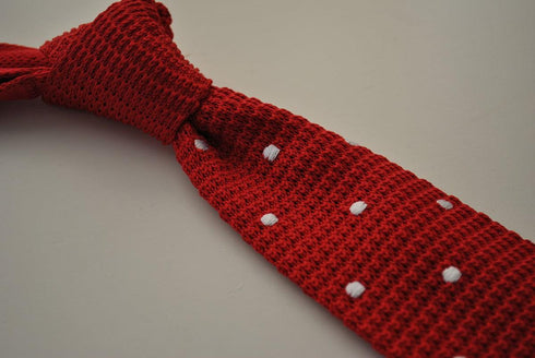 red skinny knitted tie with white polka dots