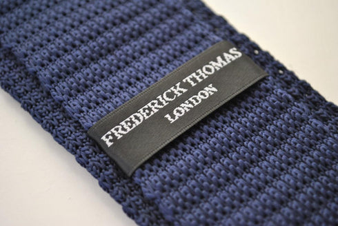 navy blue skinny knitted tie with red polka dots design