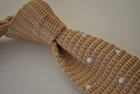 beige skinny knitted tie with white polka dots