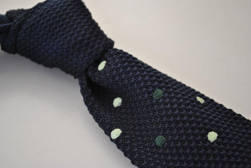 navy blue skinny knitted tie with green polka dots