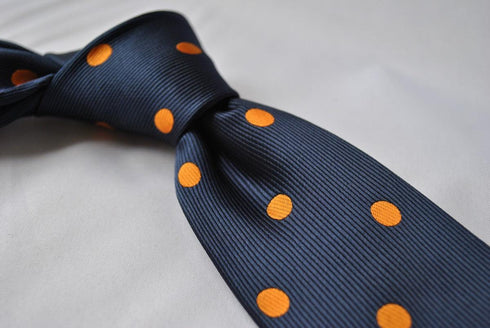 navy tie with orange polka spots