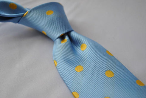light blue tie with yellow polka dots