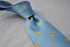light blue tie with yellow polka dots