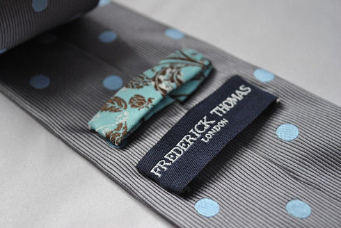 grey tie with light blue polka spot
