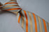 orange and white striped tie