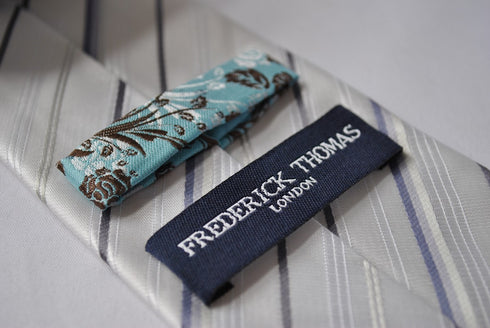 ivory tie with black and purple stripes