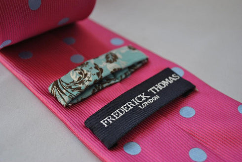bright pink tie with light blue polka dots