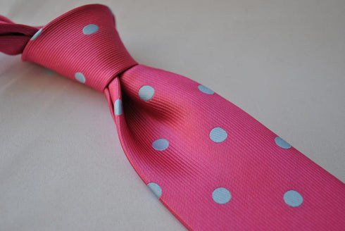 bright pink tie with light blue polka dots
