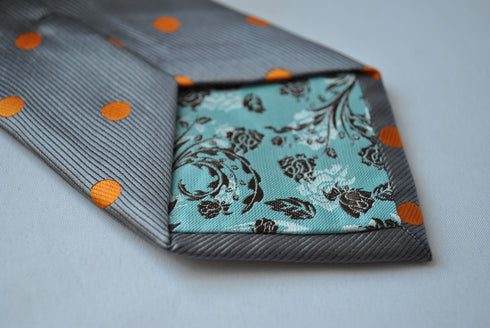 grey tie with orange polka dots