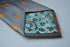 grey tie with orange polka dots