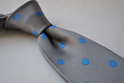 grey tie with royal blue polka dots