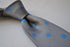 grey tie with royal blue polka dots