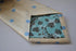 champagne tie with light blue polka dots