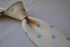 champagne tie with light blue polka dots