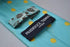 turquoise tie with yellow polka dots