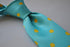 turquoise tie with yellow polka dots