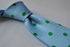 light blue tie with green polka dots