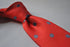 red tie with grey polka dots
