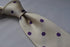 ivory tie with purple polka dots