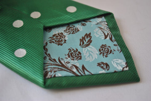 dark green tie with white polka dots