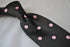 black tie with pink polka dots