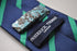 navy blue tie with green club stripes