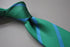 green tie with blue club stripes