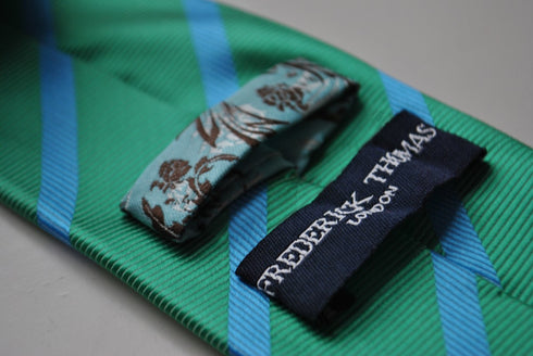 green tie with blue club stripes