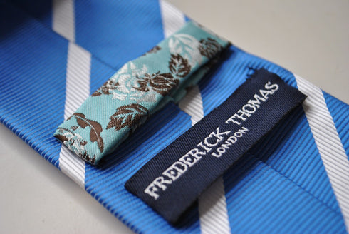 blue tie with white club stripes