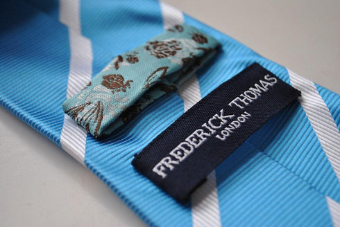 medium blue tie with white club stripes