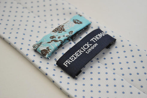 white tie with light blue pin spots