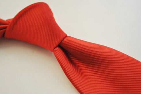 plain red tie with subtle stripes
