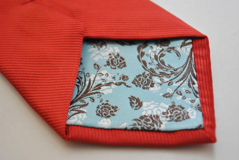 plain red tie with subtle stripes