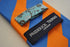burnt orange and blue barber striped tie