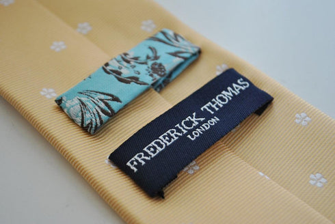 pale yellow tie with flower pattern