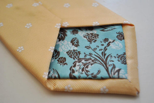 pale yellow tie with flower pattern