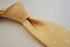 pale yellow tie with flower pattern