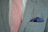 navy and white pin spotted silk pocket square with pink edging