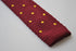 burgundy skinny knitted tie with gold polka dots
