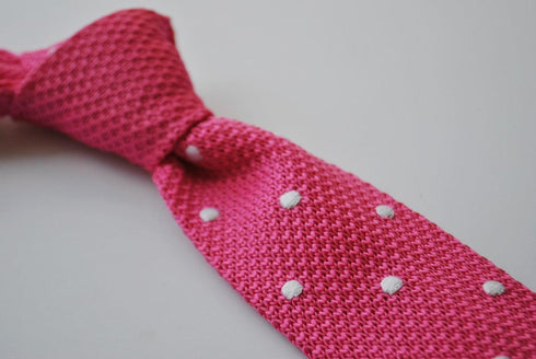 bright pink skinny knitted tie with white polka dots