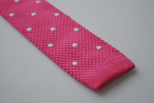 bright pink skinny knitted tie with white polka dots