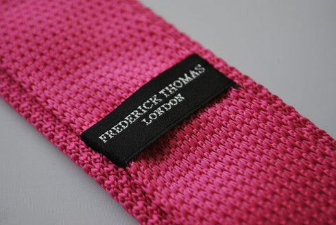bright pink skinny knitted tie with white polka dots