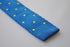 royal blue skinny knitted tie with yellow polka dots