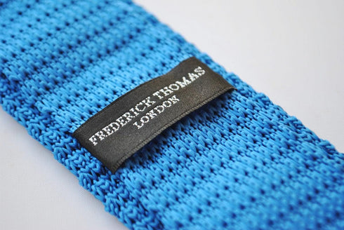 royal blue skinny knitted tie with yellow polka dots