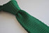 green skinny knitted tie with white tip