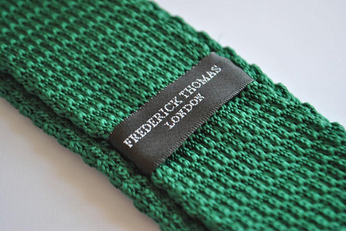 green skinny knitted tie with white tip